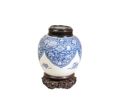 BLUE AND WHITE GINGER JAR, KANGXI PERIOD the baluster sides painted with scrolling lotus tendrils and auspicious items, with 