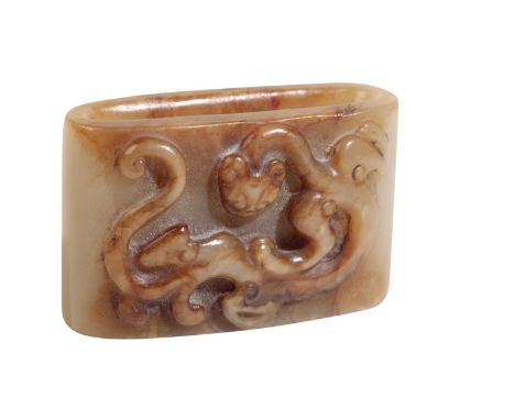 CARVED RUSSET JADE RING AND A CORAL FIGURE Height: Coral - 9cm, Width: Ring - 5cm