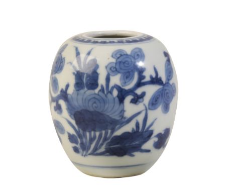 SMALL BLUE AND WHITE 'LOTUS' VASE, KANGXI PERIOD the baluster sides painted in tones of underglaze blue with a blossoming roc