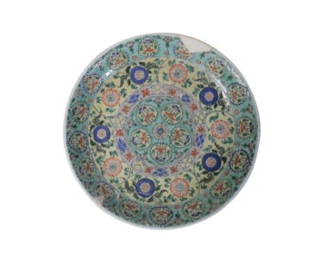 FAMILLE VERTE CHARGER, KANGXI PERIOD painted with bands of blossoming tendrils and arabesques, Diameter: 36.5cm Provenance: T