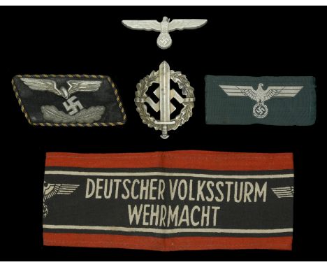 German Second World War Insignia. Comprising a Volksturm arm band, printed type; a SA Sports badge, maker marked, finish miss