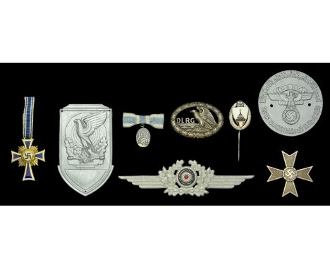 German Mixed Awards. Comprising a Mothers Cross in gold, excellent condition, some slight scratching to the white enamel to t