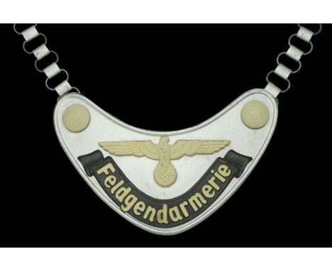 A German Second World War Feldgendarmerie Gorget. A very nice example of the all steel Feldgendarmerie Gorget, to the face si