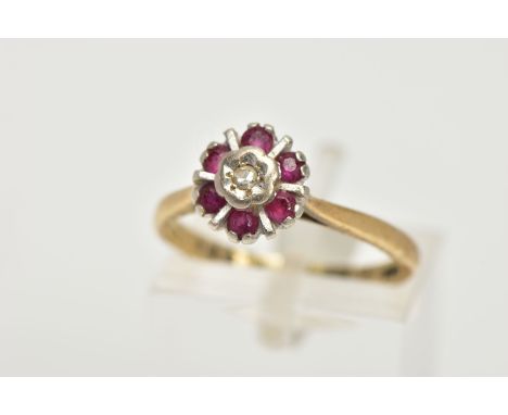 AN 18CT GOLD GEM SET CLUSTER RING, flower shape cluster set with a central single cut diamond within a surround of circular c