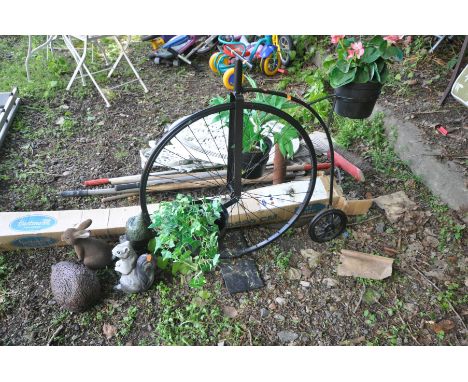 A BLACK PAINTED METAL FRAMED PLANT POT HOLDER in the shape of a penny farthing together with a small collection of garden orn