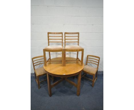 A 1930'S OAK CIRCULAR DINING TABLE, possibly by Heals &amp; Sons, on square legs, united by a cross stretcher, diameter 107cm