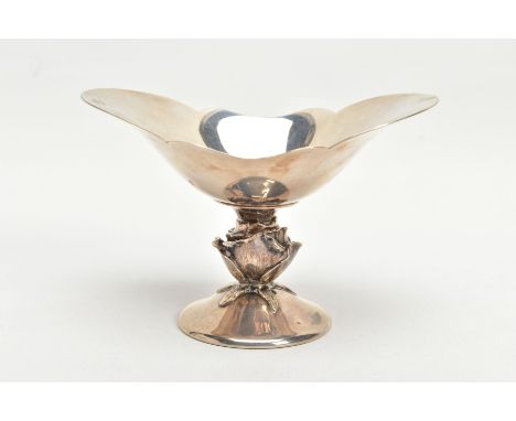 A SILVER BONBON DISH, oval bonbon dish with a part scalloped rim, raised on a stem detailed as a rose, leading onto a round b