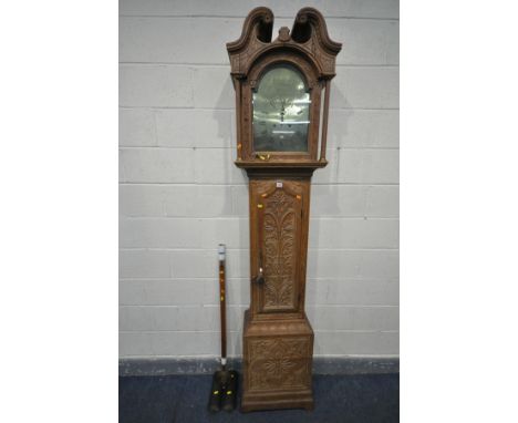 A GEORGE III LIGHT CARVED OAK EIGHT DAY LONGCASE CLOCK, the hood with a deep swan neck pediment, cylindrical pillars, flankin