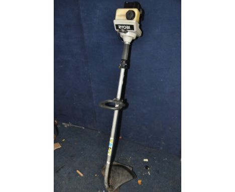 A RYOBI PETROL STRIMMER (untested but engine pulling freely)