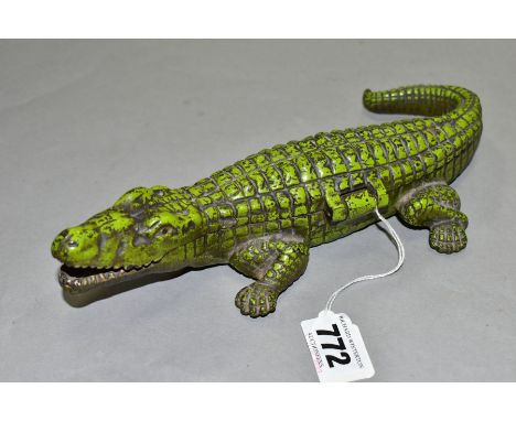 A VINTAGE CAST IRON CIGARETTE/VESTA CASE, in the form of a crocodile, with hinged lid revealing internal compartments labelle