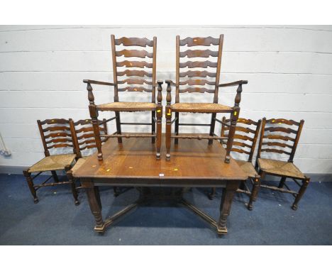 AN EARLY 20TH CENTURY FRENCH OAK EXTENDING DINING TABLE, on square tapered legs, united by bobbin turned uprights, length 134