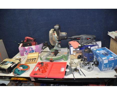 A REXON MS8RA MITRE SAW, a Ferm FBF-8E router, a Skil Clic belt Sander, a Power Devil electric Planer, a Black and Decker Jig