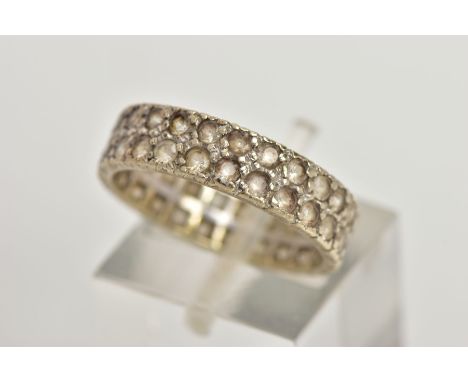 A WHITE METAL FULL ETERNITY RING, wide band set with two rows of colourless spinels, approximate width 5.2mm, stamped 9ct, ri