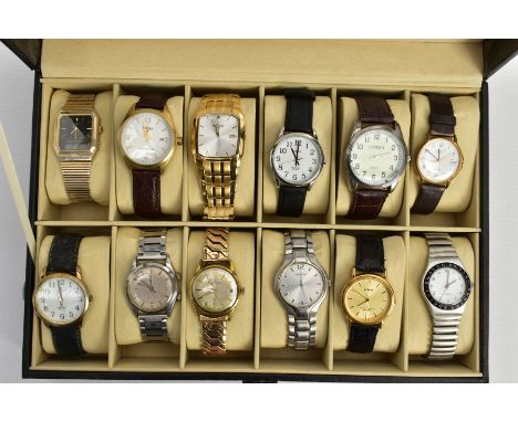 A WATCH DISPLAY CASE WITH WATCHES, black faux leather case with twelve watch storage spaces and twelve gents watches such as 