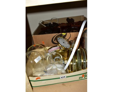 TWO BOXES OF CLOCKS AND CLOCK PARTS, including two mid-20th century cuckoo clocks, the smaller one fitted with a quartz movem
