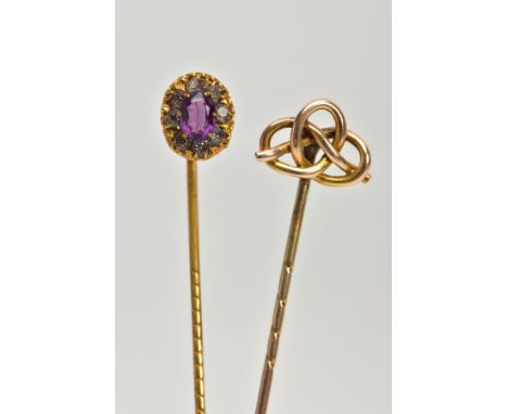 TWO YELLOW METAL STICK PINS, the first detailed with an oval cluster, centring on an oval cut amethyst in a surround of circu