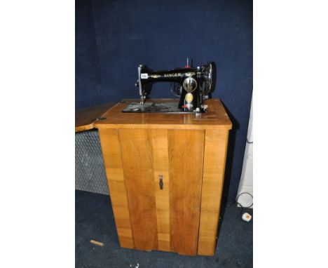 A SINGER 15K SEWING MACHINE with power cable and pedal (mounted on walnut cabinet with box of accessories and manual) (PAT pa