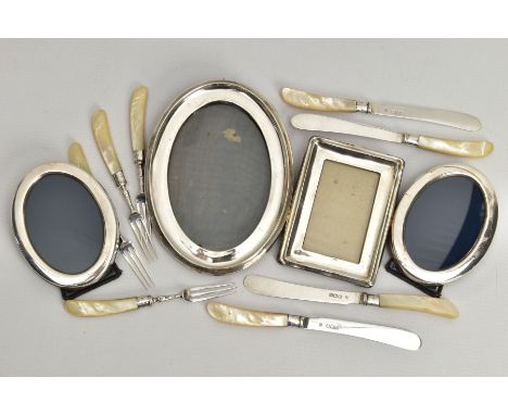 A BOX OF ASSORTED SILVERWARE, to include a set of four silver knives and forks, fitted with mother of pearl handles, hallmark