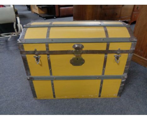 A 20th century metal bound painted dome topped trunk. 