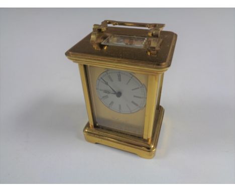 A brass cased thirteen jewel carriage clock by Richard &amp; Cie 
