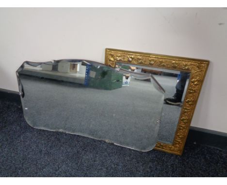 A brass embossed framed bevel edge mirror together with two frameless mirrors. 