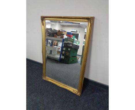 A gilt framed bevel edge overmantel mirror. 