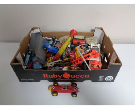 A box containing assorted die cast and plastic vehicles to include Triang Scalextric, Corgi James Bond racing cars, etc. 