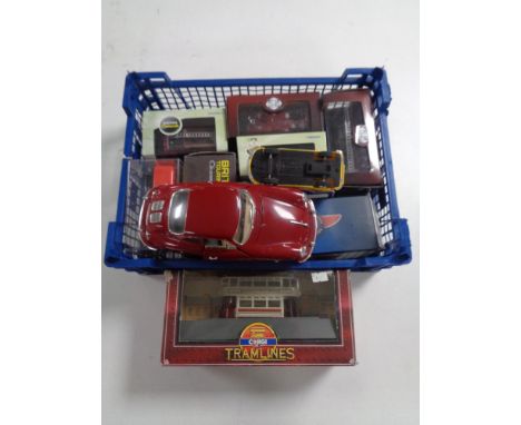 A crate containing diecast vehicles including Corgi tramlines, Burago vehicle, etc. 