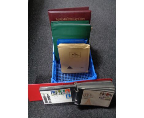 A quantity of First Day covers and albums containing stamps. 