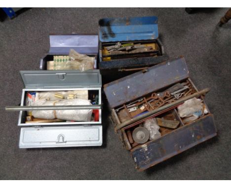 Four metal toolboxes containing assorted hand tools. 