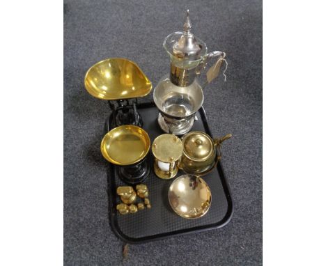 A tray containing a glass and metal wine carafe on stand, vintage kitchen scales with set of weights, brass ware to include e