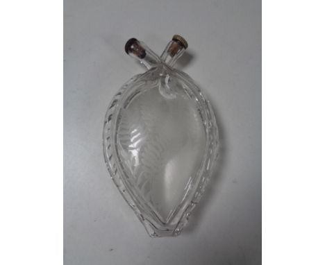 An etched glass heart shaped flask.  