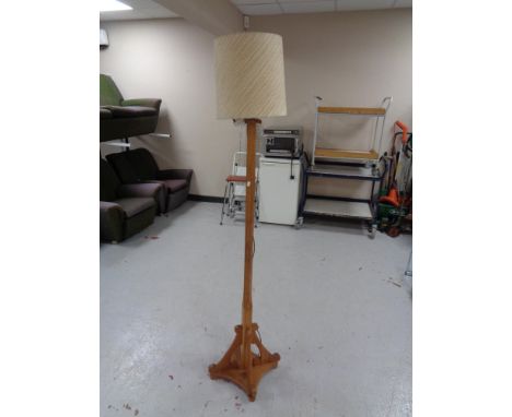 An Arts &amp; Crafts standard lamp with shade 