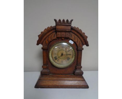 A 19th century oak cased American mantel clock by The Ansonia Clock Company.  