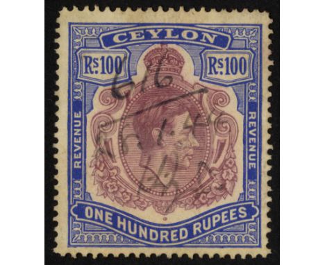 Ceylon. Revenues. 1941 100r purple and blue, line perf 14, used with manuscript and small punch cancellations; slight colour 