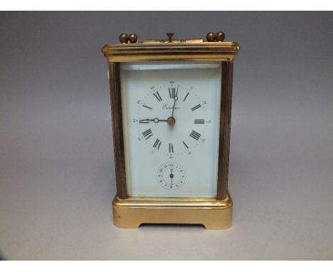 A BRASS CASED REPEATER CARRIAGE CLOCK, enamel dial bearing Roman numerals, retailed by 'Eurotime', subsidiary dial below,  tw