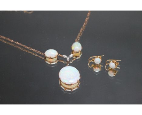 A THREE STONE OPAL AND DIAMOND NECKLACE, the largest opal measuring approx 23 mm x 19 mm, together with a pair of circular op