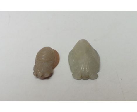 A CARVED CELADON JADE INSECT, L 3.8 cm, together with a smaller celadon and brown jade insect, L 3.2 cm (2)