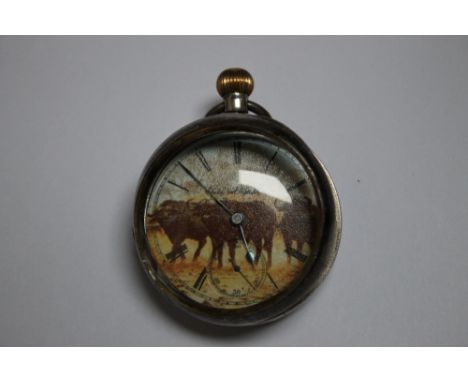 A HALLMARKED SILVER OPEN FACED MANUAL WIND POCKET WATCH, with unusual Buffalo design dial, Dia 5 cm A/F