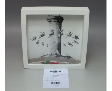 BANKSY (1974). The Walled Off Hotel box set giclee print with concrete relief element, in original framed, 25.5 x 25.5 cmProv