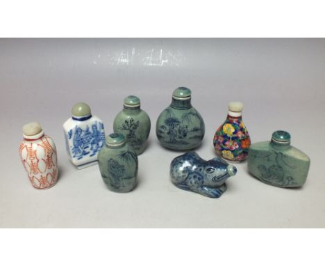 A COLLECTION OF ORIENTAL CERAMIC SNUFF BOTTLES, to include an unusual animal shaped example, all but one with character marks