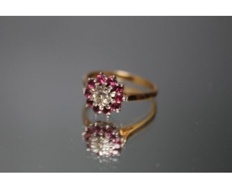 A HALLMARKED 18 CARAT GOLD RUBY AND DIAMOND RING, ring size Q