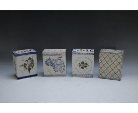 A COLLECTION OF FOUR ORIENTAL CERAMIC PILLOWS, of typical form in mainly blue and white, H 13.75 cm
