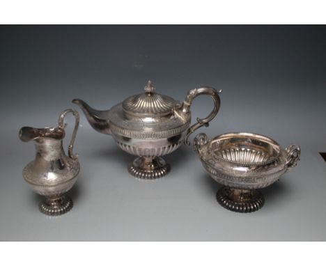 AN ORNATE SILVER PLATED THREE PIECE TEA SERVICE, teapot W 30 cm