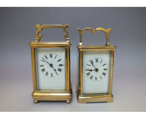 A DUVERDREY AND BLOQUEL BRASS CASED CARRIAGE CLOCK, the case with five glass panels having visible escapement, raised on bun 