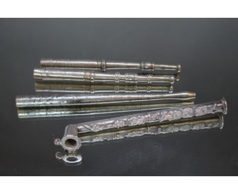 A CHINESE WHITE METAL OPIUM PIPE,  heavily decorated with dragons, frogs etc, L  together with there plated cigarette holders