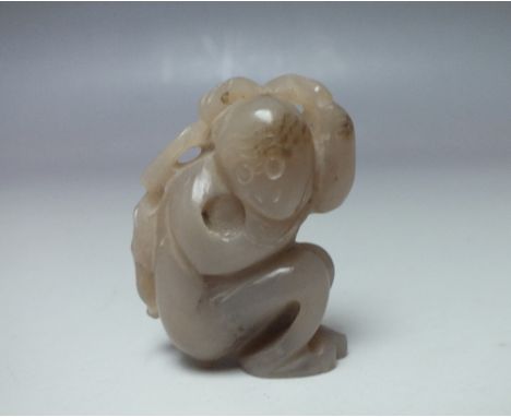 A PALE BROWN JADE CARVING OF A MONKEY, finely carved detail, H 5.3 cm