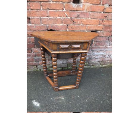 AN ANTIQUE STYLE OAK DROPLEAF TABLE, the octagonal top raised on bobbin turned supports, H 73 cm, W 75 cm