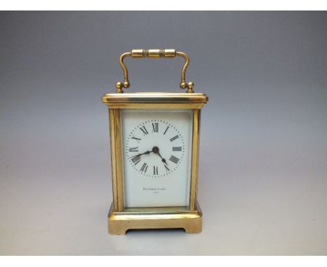 A HEITZMAN AND SONS OF PARIS BRASS CASED CARRIAGE CLOCK, the case with five glass panels having visible escapement, overall H