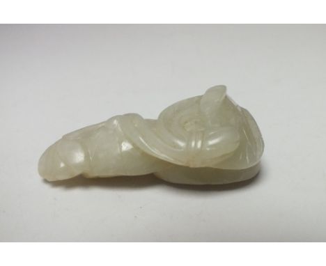 A CHINESE CELADON JADE DOUBLE FRUITING GOURD, finely carved detail depicting fruiting gourds upon a double gourd-shaped base,